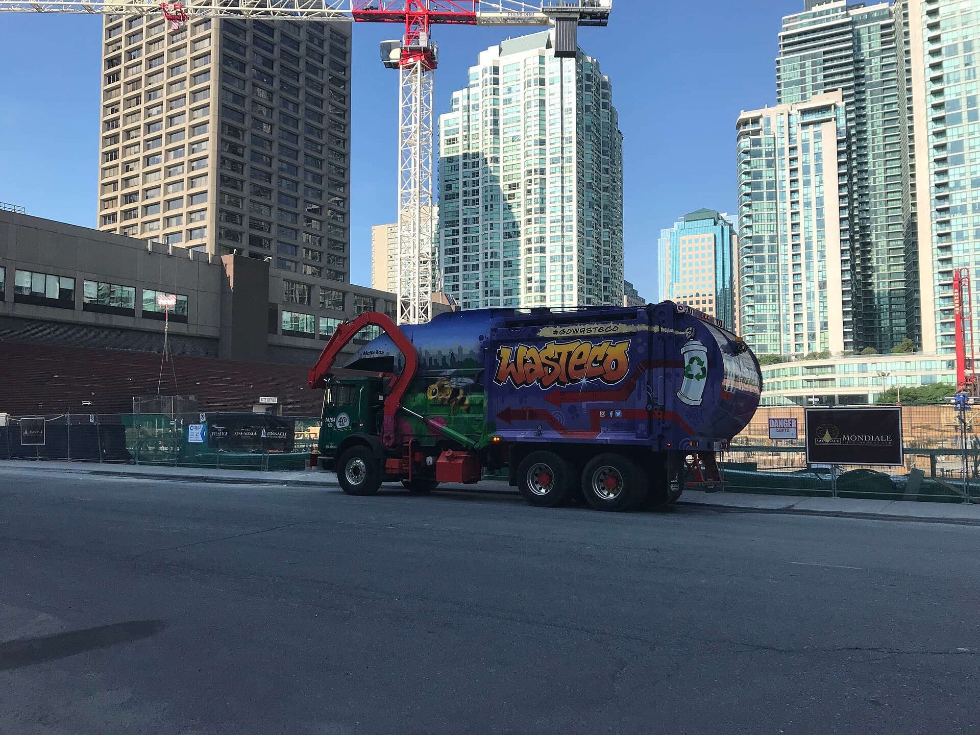A garbage truck on a city street