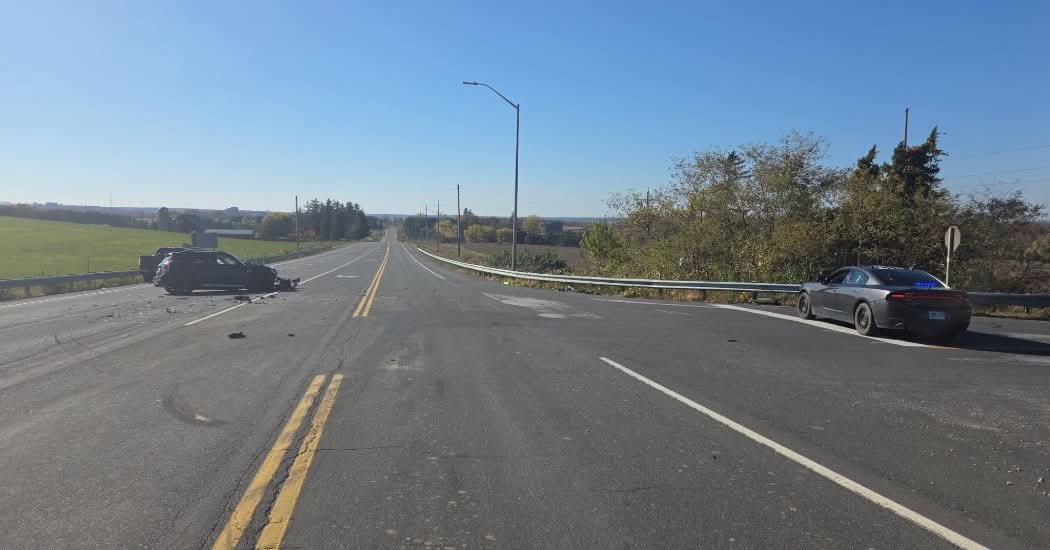 A damaged vehicle on Highway 26 at Grey Road 15 in Meaford, with an OPP cruiser at the side of the road.